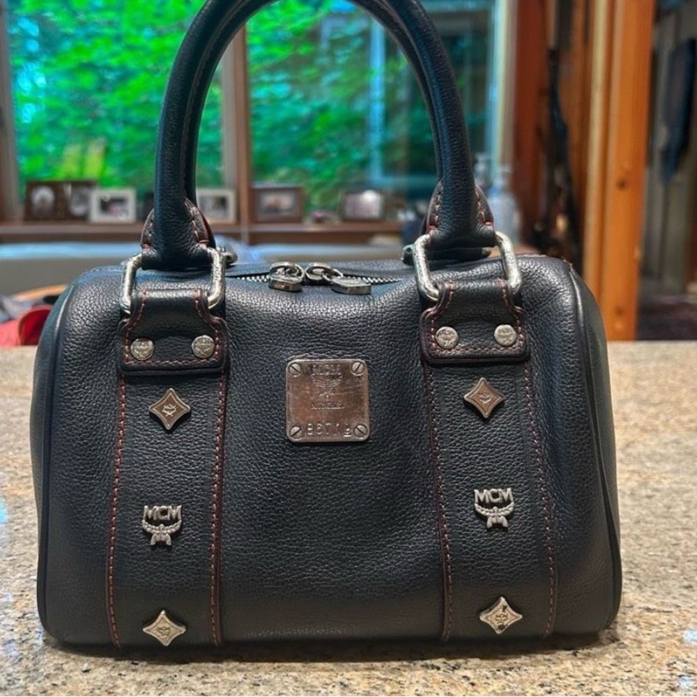 MCM Mini Black Leather
Red stitching Silver Studded Boston bag.  GORGEOUSNESS.